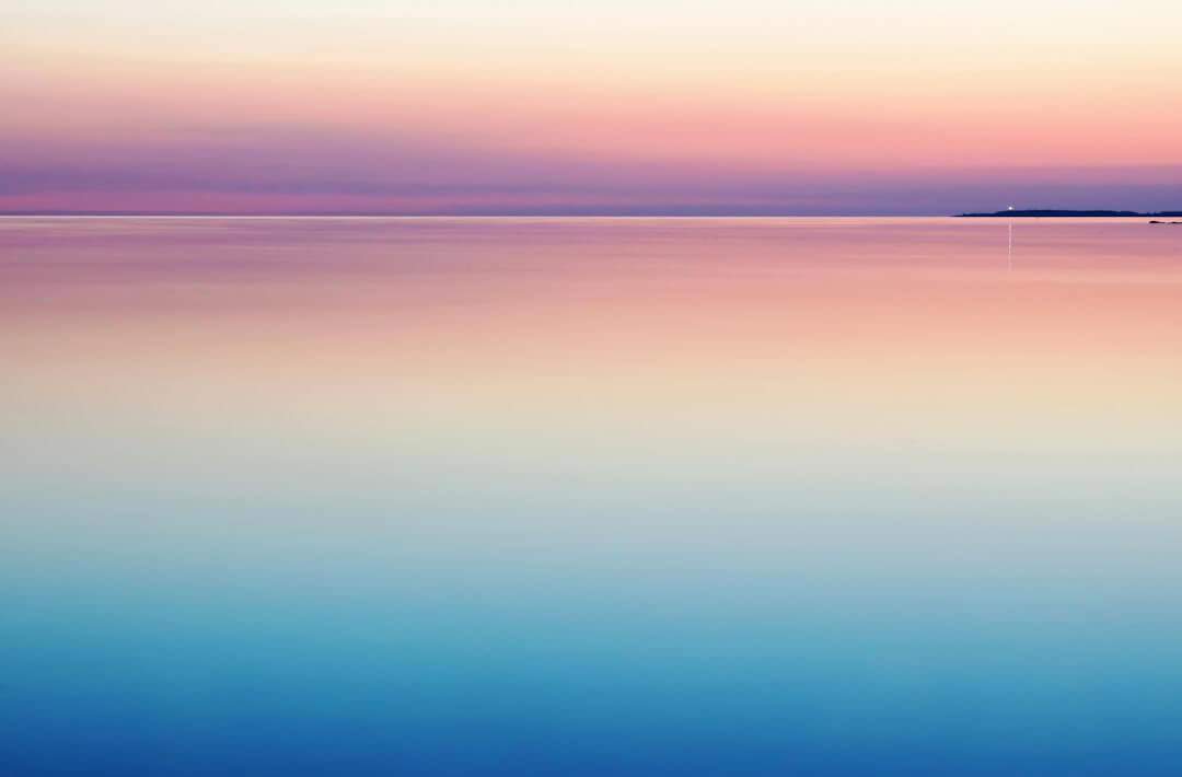 A person standing in soft morning light looking calm and quietly confident, ready to be noticed